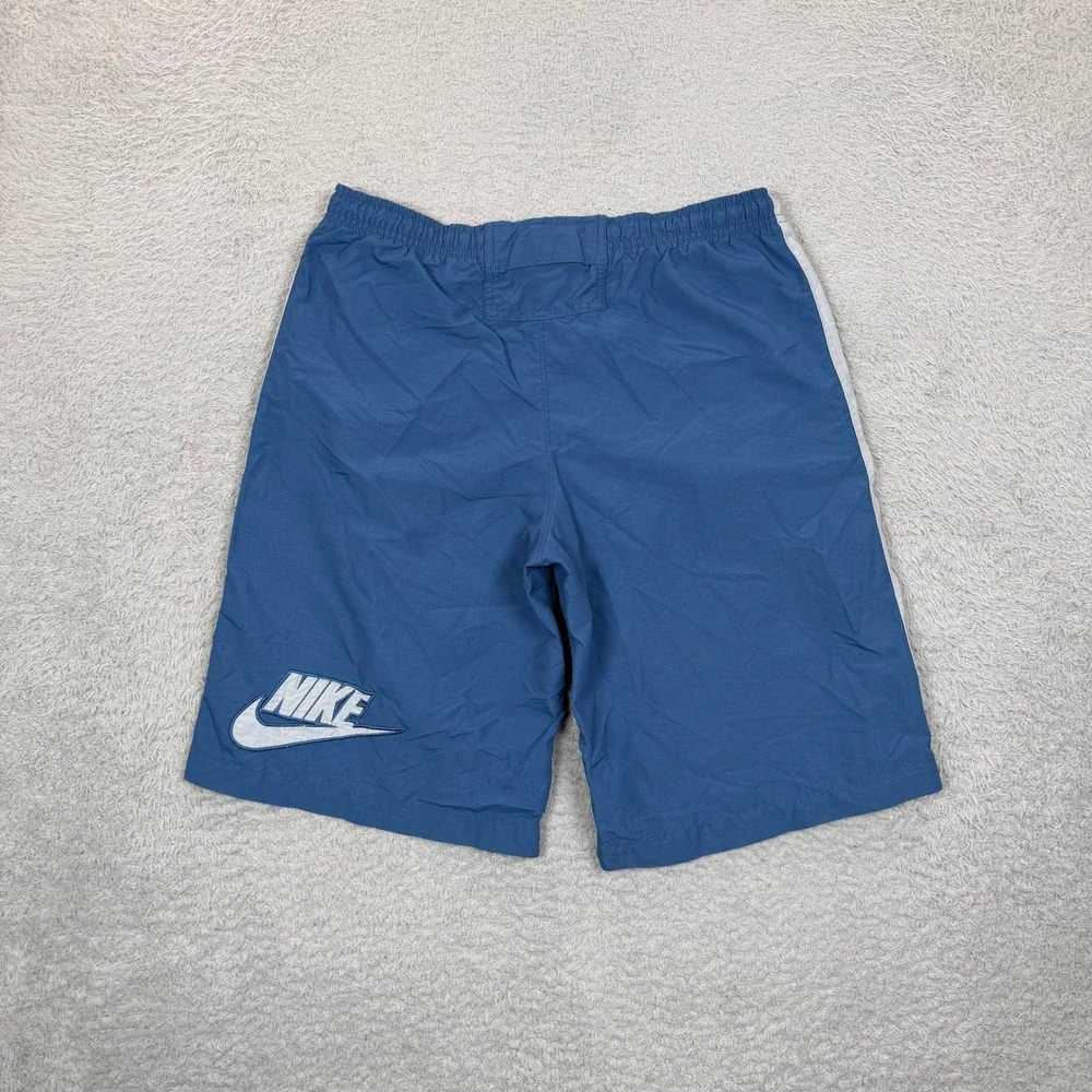 Vintage Nike Boys Blue Nylon Athletic Shorts White Side Stripe Logo Size Medium